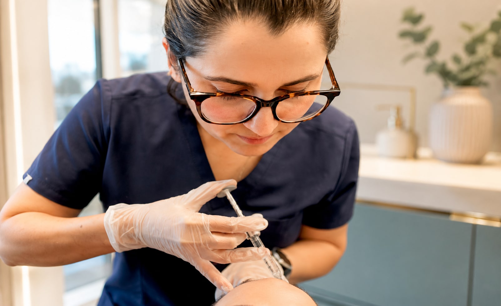 The GP Aesthetics practitioner preparing an aesthetic treatment in clinic.